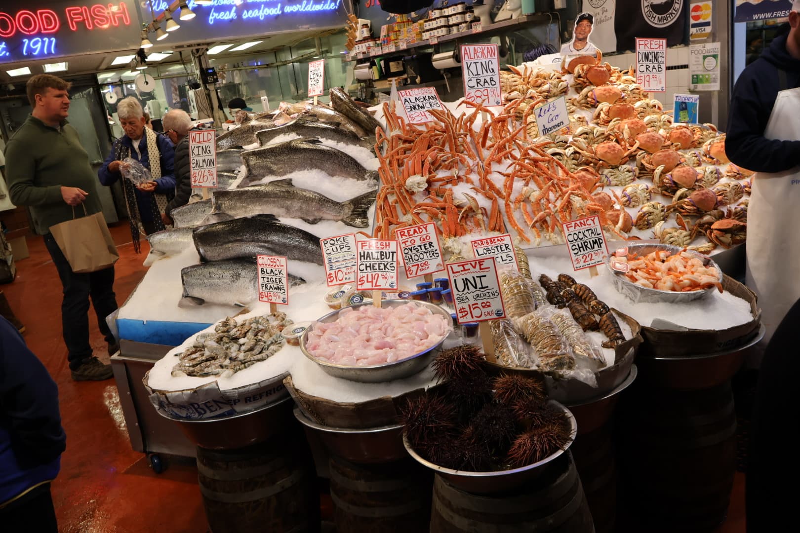Fresh seafood display with salmon, crab, and sea urchin at Pike Place