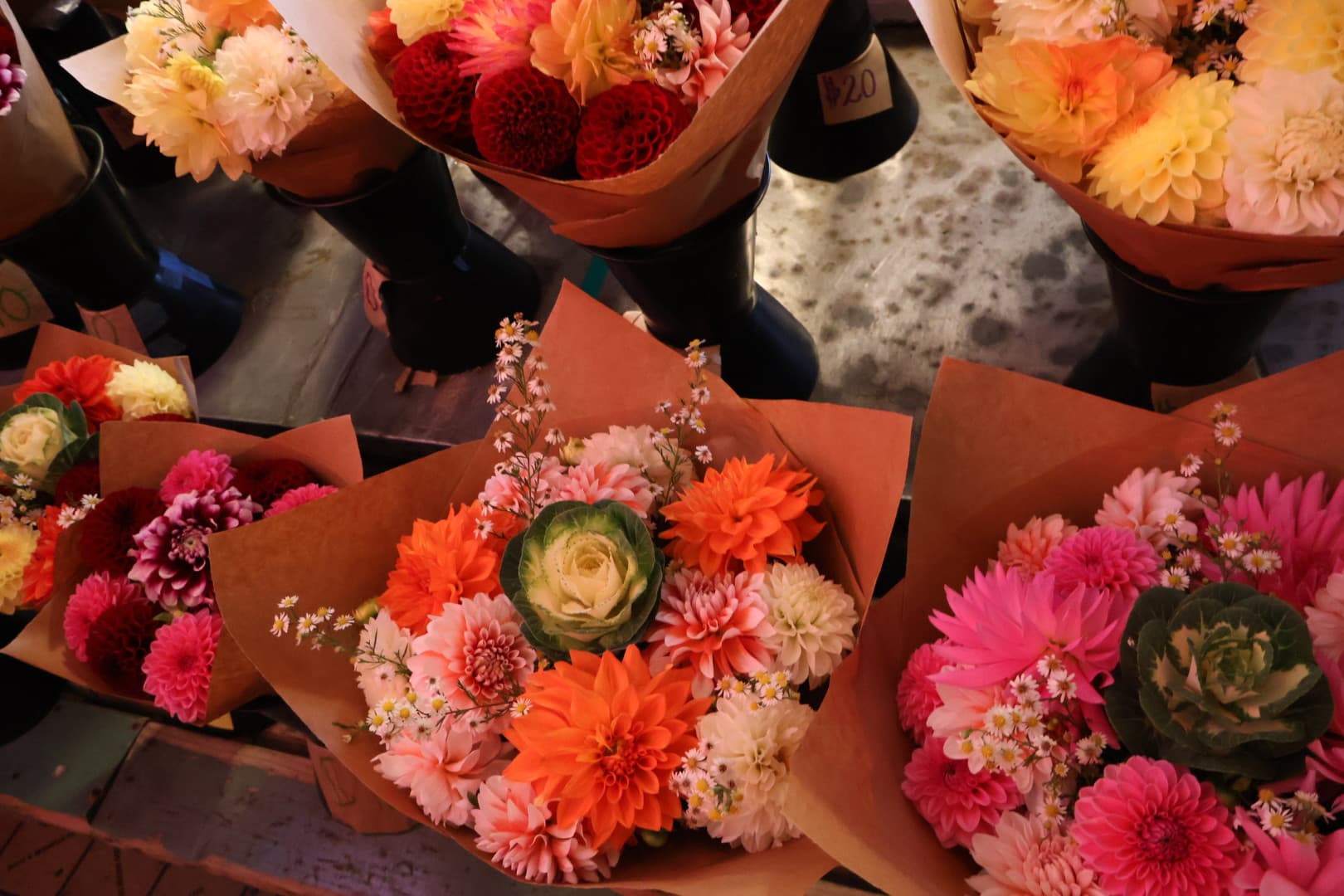 Vibrant flower bouquets in orange, pink, and red at Pike Place Market